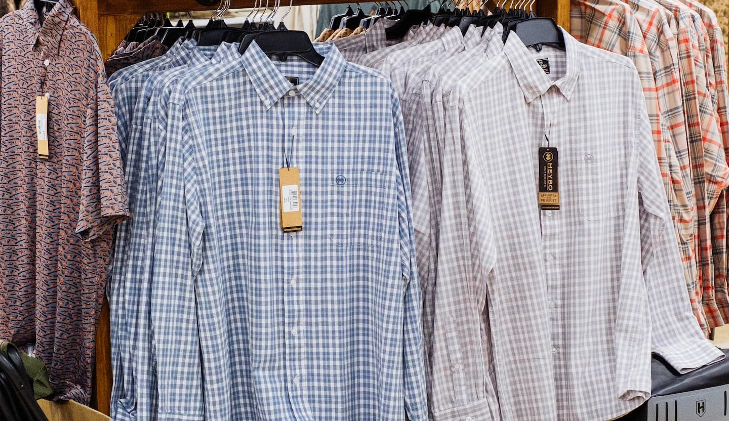 Display of Heybo Outdoor apparel at Anderson’s General Store featuring breathable plaid button-ups.
